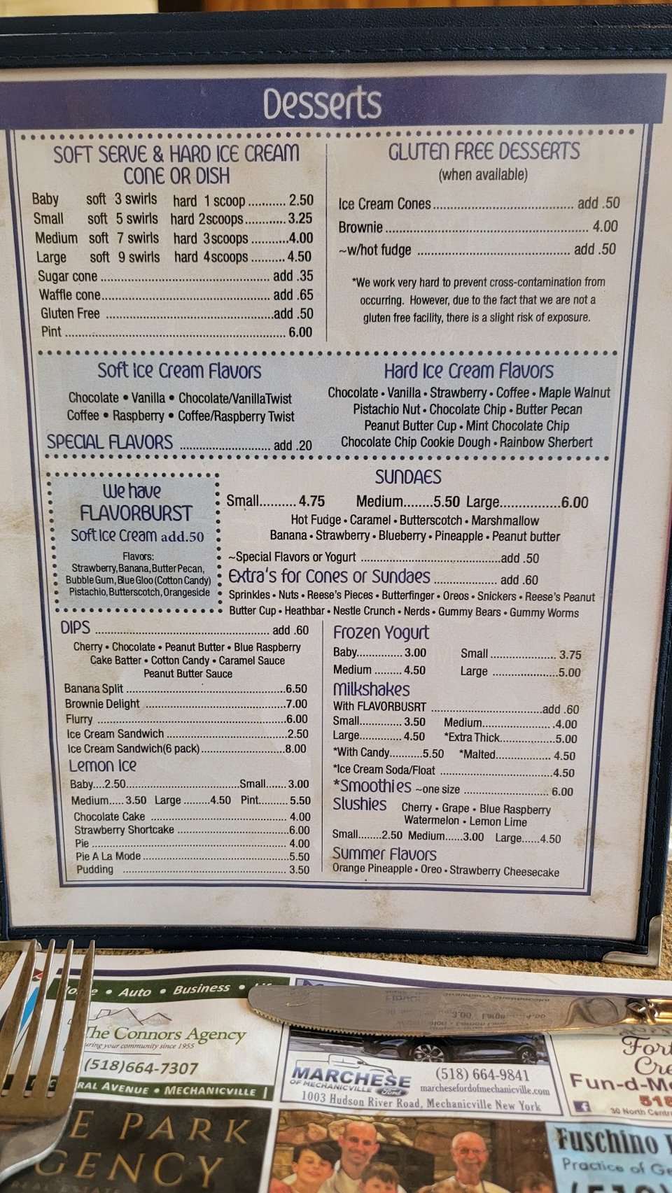 Restaurant menu close-up with category headings.